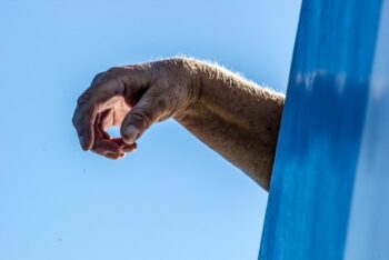 a mans wrist in flexion position