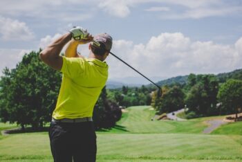 man golfing in daytime